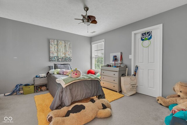 705 Ridge Gate Dr, Brownsburg, IN 46112 - carpeted bedroom featuring ceiling fan and a textured ceiling