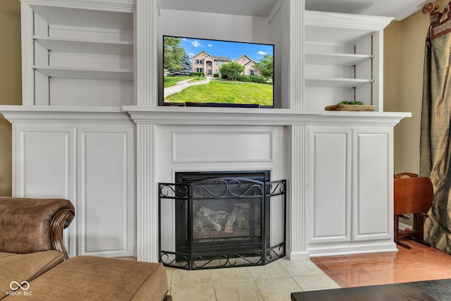 705 Ridge Gate Dr, Brownsburg, IN 46112 - detailed view of built in shelves and a fireplace with flush hearth