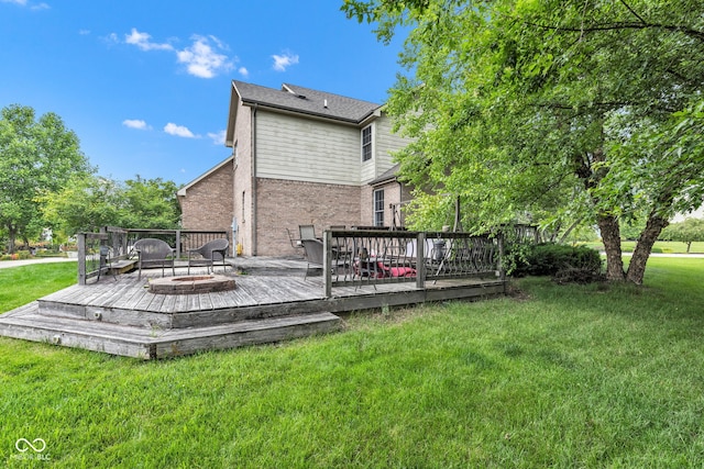 705 Ridge Gate Dr, Brownsburg, IN 46112 - back of house with brick siding, a wooden deck, and a lawn