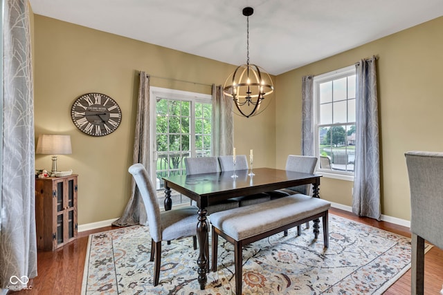 705 Ridge Gate Dr, Brownsburg, IN 46112 - dining space featuring a chandelier, healthy amount of natural light, and wood finished floors