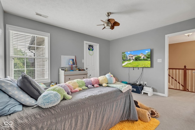 705 Ridge Gate Dr, Brownsburg, IN 46112 - bedroom featuring carpet flooring, multiple windows, and a ceiling fan