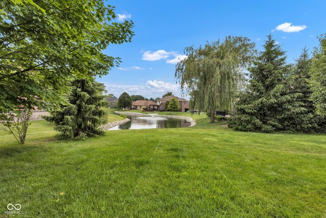 705 Ridge Gate Dr, Brownsburg, IN 46112 - view of green lawn with a water view