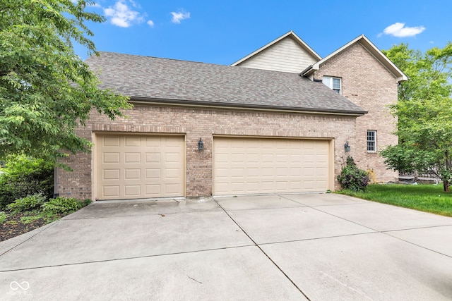 705 Ridge Gate Dr, Brownsburg, IN 46112 - view of property exterior with brick siding, a garage, concrete driveway, and roof with shingles