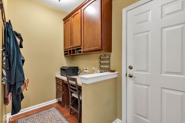 705 Ridge Gate Dr, Brownsburg, IN 46112 - home office featuring wood finished floors and built in desk