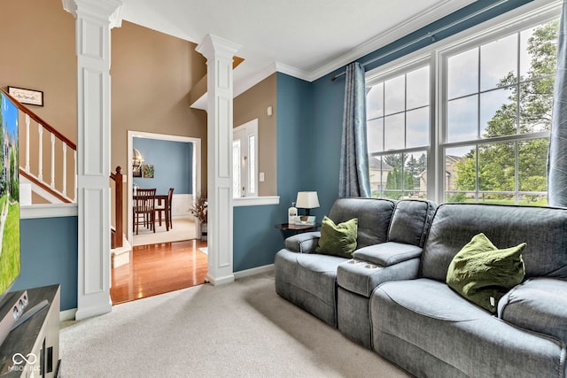 705 Ridge Gate Dr, Brownsburg, IN 46112 - carpeted living area featuring ornate columns and ornamental molding