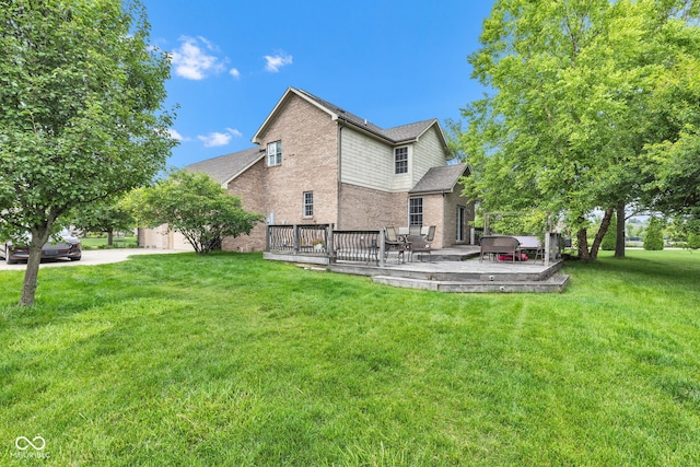 705 Ridge Gate Dr, Brownsburg, IN 46112 - rear view of property with brick siding, a deck, a jacuzzi, and a yard