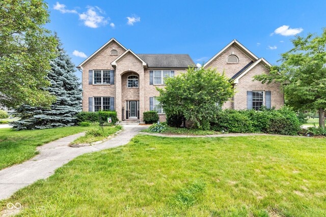 705 Ridge Gate Dr, Brownsburg, IN 46112 - view of front of house featuring brick siding and a front yard