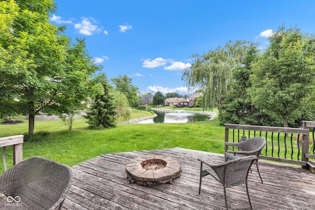 705 Ridge Gate Dr, Brownsburg, IN 46112 - wooden terrace with a water view, a fire pit, and a yard