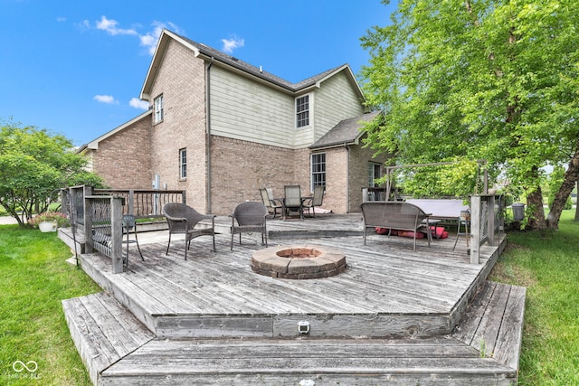705 Ridge Gate Dr, Brownsburg, IN 46112 - wooden deck with a fire pit and a yard