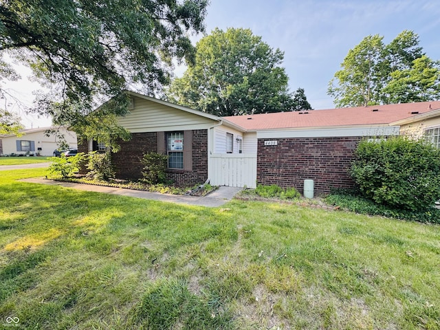 4408 Clovelly Ct, Indianapolis, IN 46254 - ranch-style home featuring brick siding and a front yard