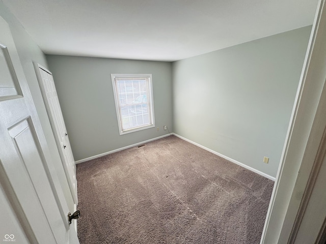 4408 Clovelly Ct, Indianapolis, IN 46254 - spare room featuring carpet and baseboards