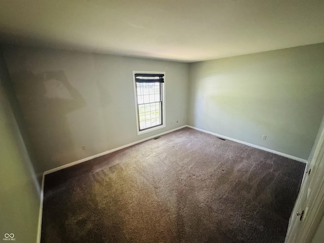 4408 Clovelly Ct, Indianapolis, IN 46254 - empty room featuring baseboards and dark colored carpet