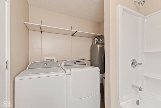 7928 Vontress St, Coatesville, IN 46121 - laundry area with washing machine and clothes dryer, electric water heater, and a textured ceiling