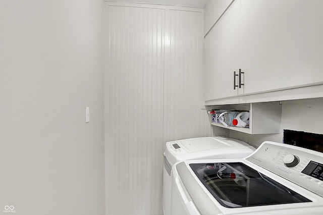 12606 Markay Dr, Fishers, IN 46038 - laundry room with cabinet space and washer and clothes dryer