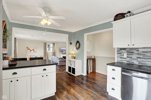 12606 Markay Dr, Fishers, IN 46038 - kitchen with stainless steel dishwasher, dark countertops, decorative backsplash, ceiling fan, and ornamental molding