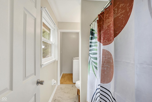 12606 Markay Dr, Fishers, IN 46038 - hallway with marble finish flooring and washer / clothes dryer