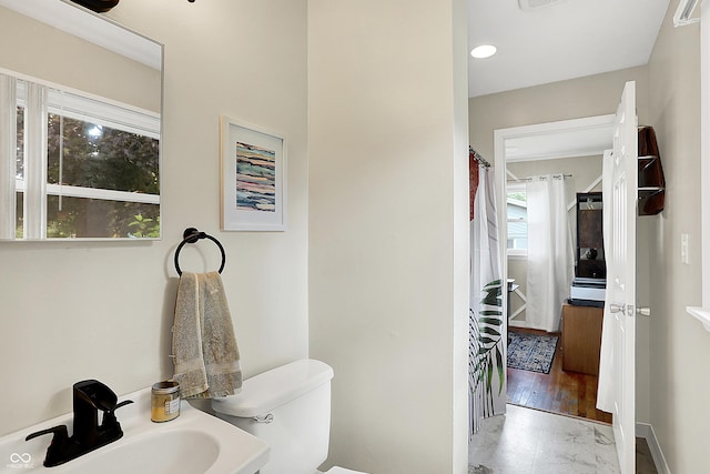 12606 Markay Dr, Fishers, IN 46038 - bathroom featuring marble look tile flooring and recessed lighting