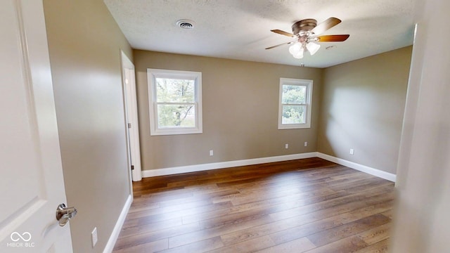 15 Morton Way, Batesville, IN 47006 - unfurnished room featuring dark wood-type flooring, a ceiling fan, and a textured ceiling