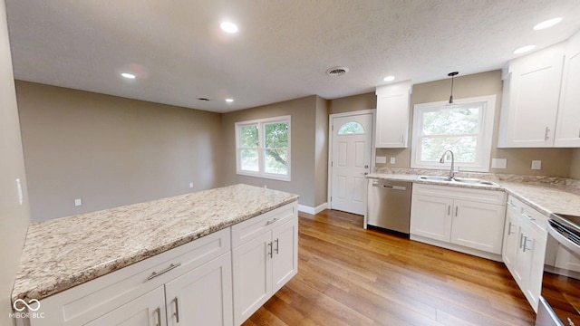15 Morton Way, Batesville, IN 47006 - kitchen featuring stainless steel appliances, recessed lighting, white cabinets, light stone counters, and light wood-style flooring