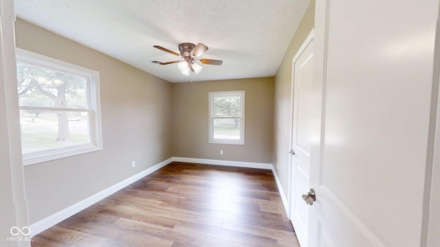 15 Morton Way, Batesville, IN 47006 - unfurnished room with a ceiling fan, wood finished floors, and a textured ceiling