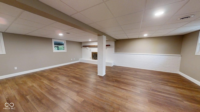 15 Morton Way, Batesville, IN 47006 - below grade area with wood finished floors, a drop ceiling, recessed lighting, and brick wall