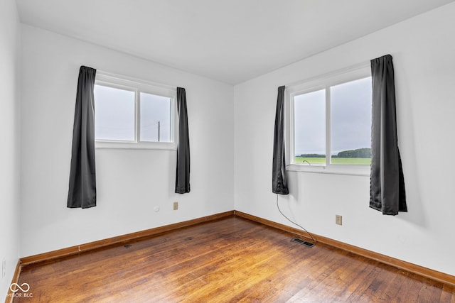 10965 W Base Line Rd, Jamestown, IN 46147 - spare room featuring baseboards and hardwood / wood-style floors