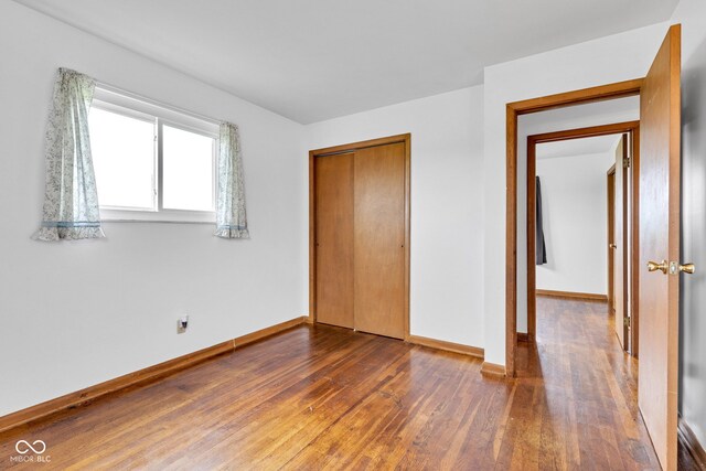 10965 W Base Line Rd, Jamestown, IN 46147 - unfurnished bedroom featuring wood finished floors and a closet