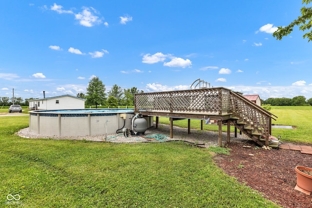 10965 W Base Line Rd, Jamestown, IN 46147 - view of grassy yard with a wooden deck, an outdoor pool, and stairs