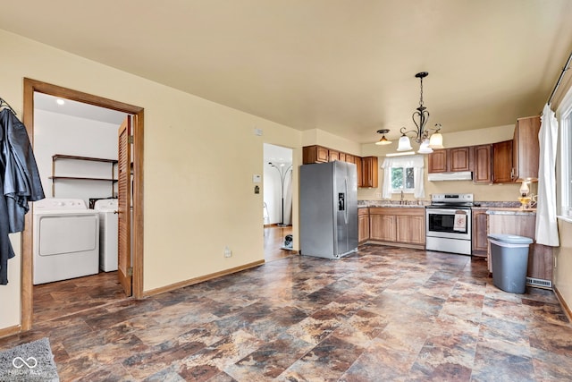 10965 W Base Line Rd, Jamestown, IN 46147 - kitchen featuring stainless steel appliances, stone finish floors, light countertops, under cabinet range hood, and a chandelier