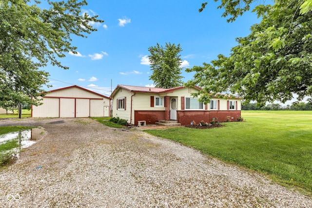 10965 W Base Line Rd, Jamestown, IN 46147 - ranch-style home featuring a front lawn, brick siding, a garage, and driveway