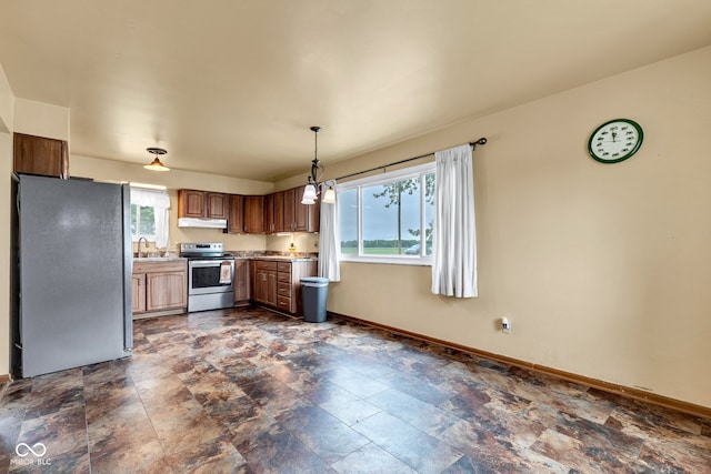 10965 W Base Line Rd, Jamestown, IN 46147 - kitchen featuring stainless steel appliances, under cabinet range hood, dark stone finish flooring, and light countertops