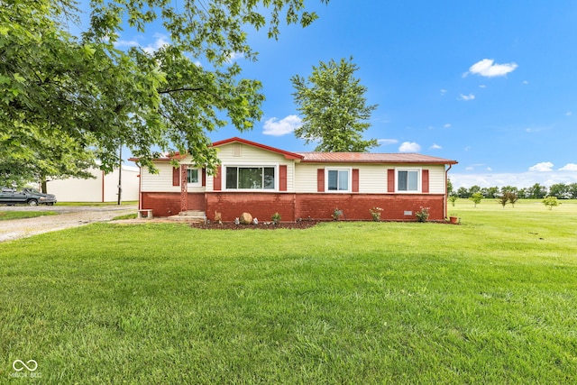 10965 W Base Line Rd, Jamestown, IN 46147 - single story home featuring a front lawn, brick siding, dirt driveway, and a metal roof