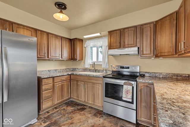 10965 W Base Line Rd, Jamestown, IN 46147 - kitchen featuring appliances with stainless steel finishes, under cabinet range hood, stone finish flooring, and brown cabinetry