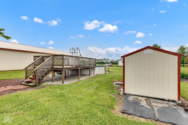 10965 W Base Line Rd, Jamestown, IN 46147 - view of grassy yard with a deck, stairway, and a storage shed