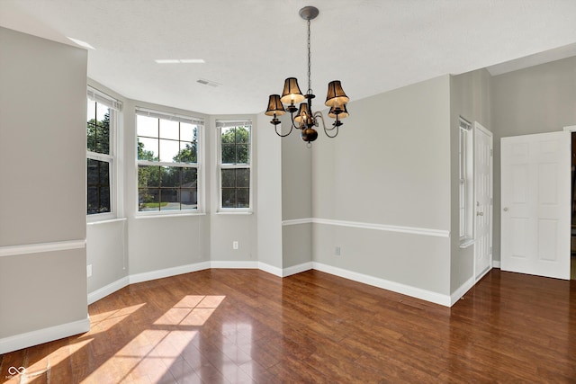 9055 Glass Chimney Ln, Fishers, IN 46037 - spare room with a chandelier and wood finished floors
