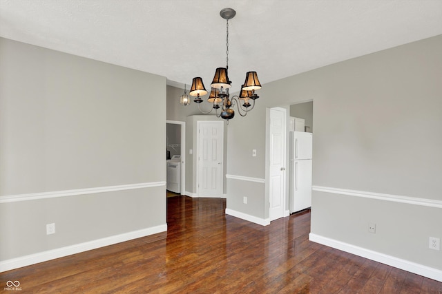 9055 Glass Chimney Ln, Fishers, IN 46037 - spare room with a chandelier, washer / clothes dryer, and hardwood / wood-style floors