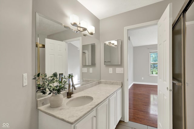 9055 Glass Chimney Ln, Fishers, IN 46037 - bathroom featuring vanity and a chandelier