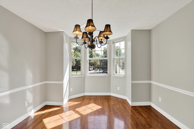 9055 Glass Chimney Ln, Fishers, IN 46037 - unfurnished dining area featuring a chandelier and hardwood / wood-style floors