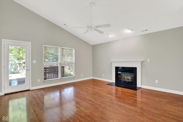 9055 Glass Chimney Ln, Fishers, IN 46037 - unfurnished living room featuring a ceiling fan, high vaulted ceiling, wood finished floors, and a glass covered fireplace