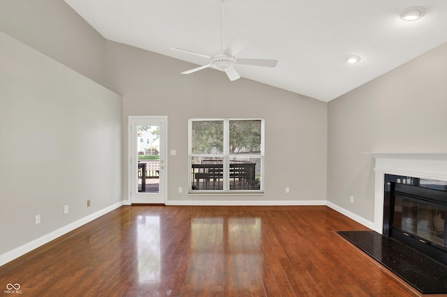 9055 Glass Chimney Ln, Fishers, IN 46037 - unfurnished living room with a ceiling fan, wood finished floors, a glass covered fireplace, and lofted ceiling