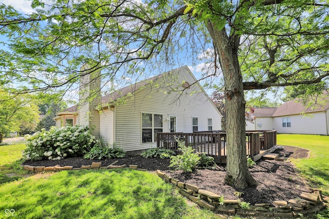 9055 Glass Chimney Ln, Fishers, IN 46037 - view of side of property featuring a deck, a lawn, and a chimney