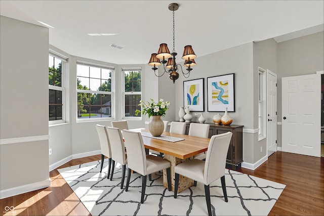 9055 Glass Chimney Ln, Fishers, IN 46037 - dining area featuring a chandelier and wood finished floors