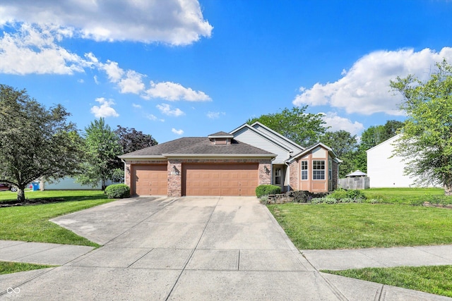 9055 Glass Chimney Ln, Fishers, IN 46037 - view of front of home featuring brick siding, a front yard, a garage, and concrete driveway
