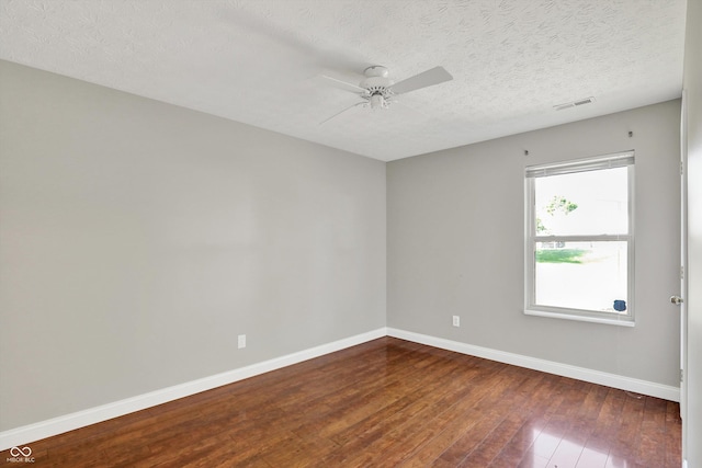 9055 Glass Chimney Ln, Fishers, IN 46037 - spare room with dark wood-type flooring, a ceiling fan, and a textured ceiling