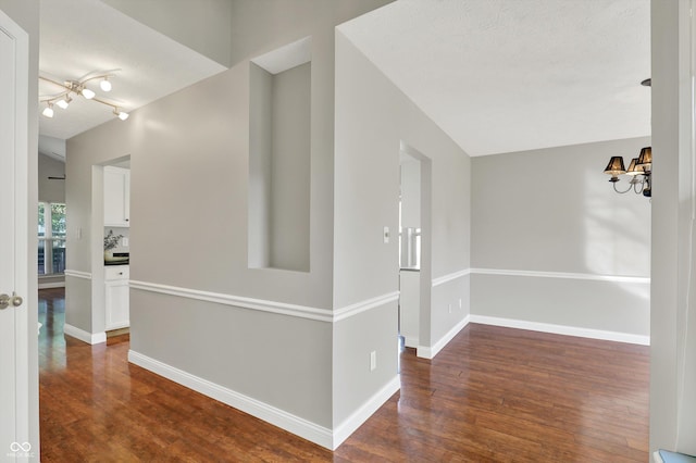 9055 Glass Chimney Ln, Fishers, IN 46037 - hallway featuring a chandelier and wood finished floors