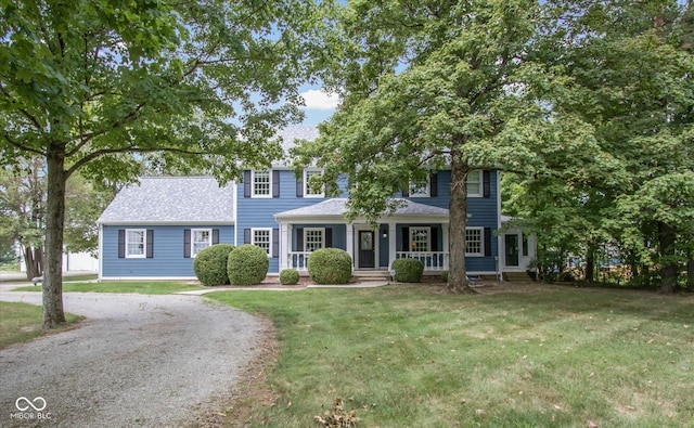 5538 N 700 W, Mccordsville, IN 46055 - view of front of home featuring a porch, a front yard, gravel driveway, and a shingled roof