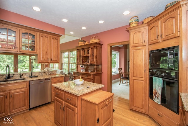 5538 N 700 W, Mccordsville, IN 46055 - kitchen featuring black appliances, light stone counters, glass insert cabinets, light wood finished floors, and recessed lighting