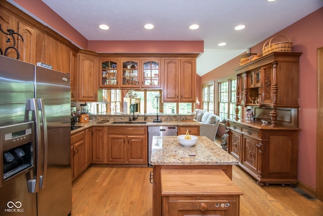 5538 N 700 W, Mccordsville, IN 46055 - kitchen featuring stainless steel appliances, brown cabinetry, a kitchen island, and recessed lighting
