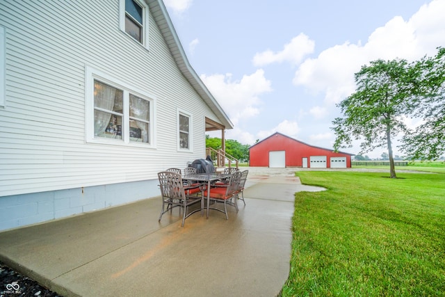 4491 W 600 N, Anderson, IN 46011 - view of patio featuring an outdoor structure, a garage, and outdoor dining space