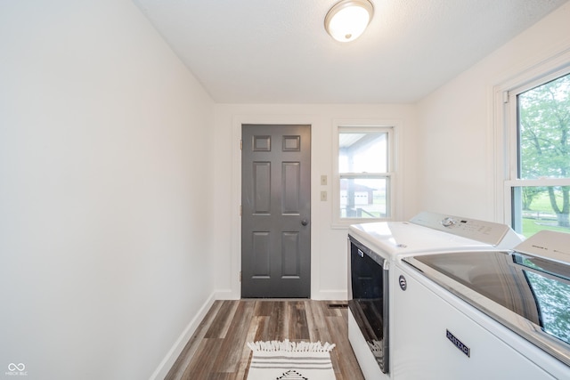 4491 W 600 N, Anderson, IN 46011 - laundry room with independent washer and dryer, light wood-style floors, and plenty of natural light
